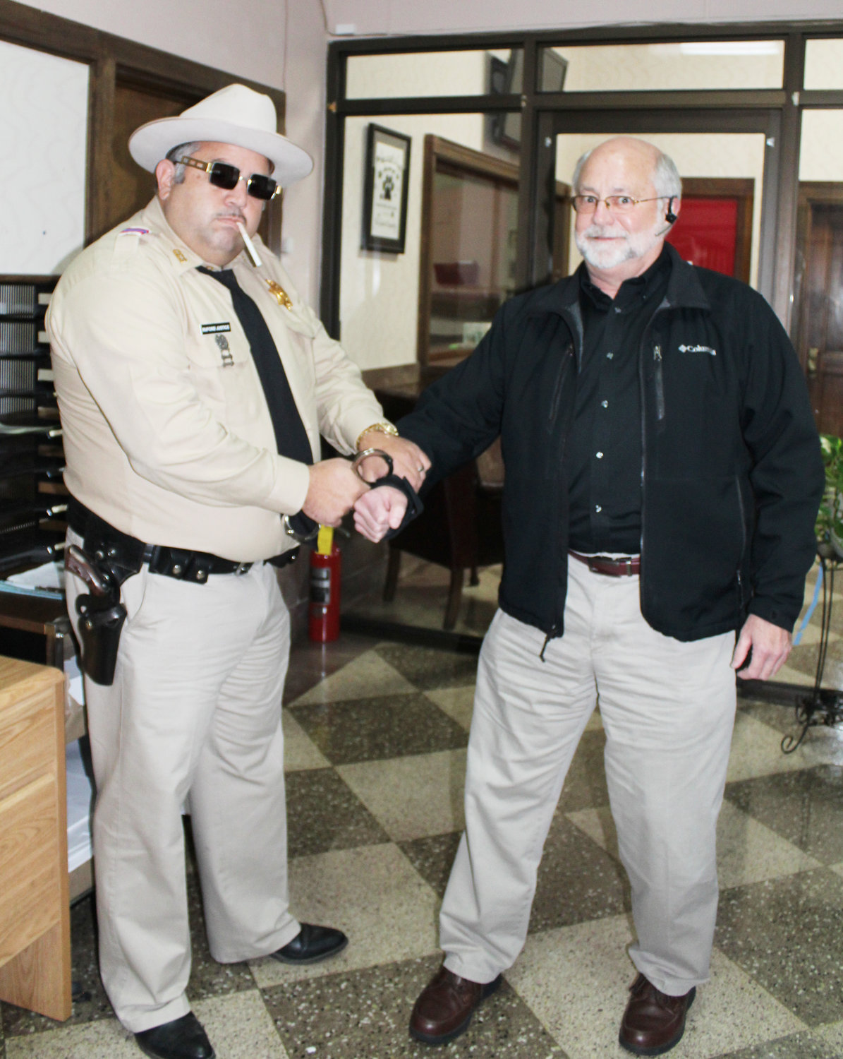 Buford T. Justice (Matt Cutter) “arrests” Chamber president Marvin Bullock for violating the “Code of Justice.”